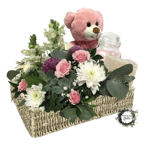 Baby girl flowers with teddy bear, soap and candle.